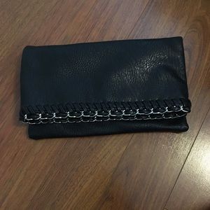 Black leather clutch with metal knit embellishment